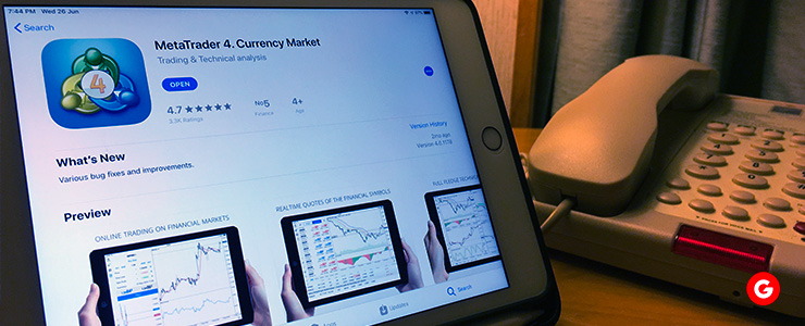 A tablet displaying MetaTrader 4, underscoring the role of risk management in the trading process.