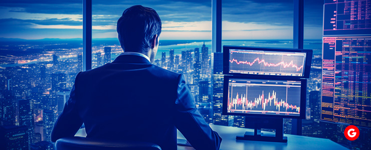 A trader attentively studies a board filled with charts, emphasizing the importance of their trading plan in decision-making.