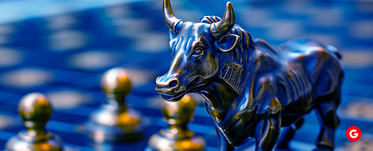 A bull statue placed on a chess board, symbolizing strength and strategy in the market