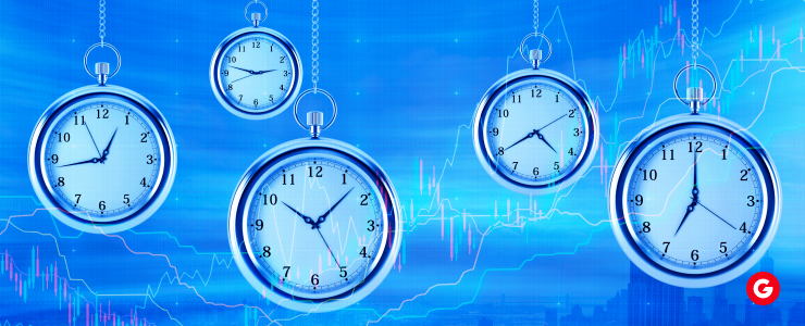 Five clocks on a string, set against a blue backdrop, illustrating various time zones relevant to forex trading.